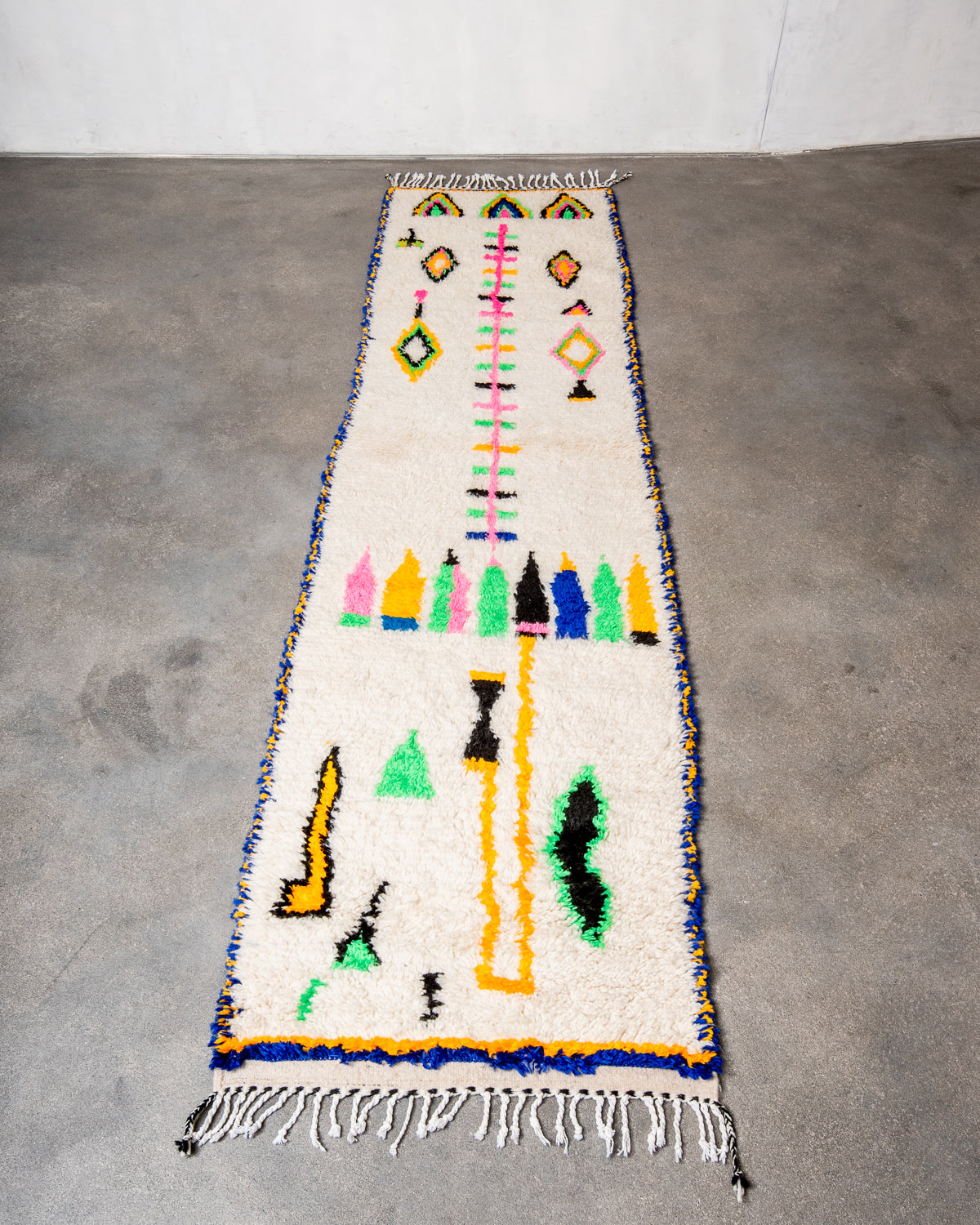 Modern designer handcrafted Berber rug from Morocco. Azilal runner rug with beautiful colors and patterns. Made of sheep’s wool and colourful cotton.
